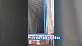 Beladung der Folienwickelmaschine in einen Container